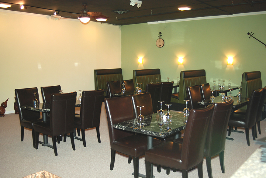 The compact commercial kitchen design allows more space for dining.