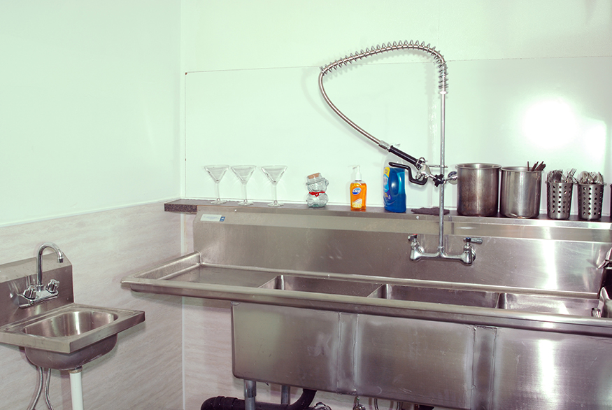 A compact scullery meets contemporary codes with minimum use of space.